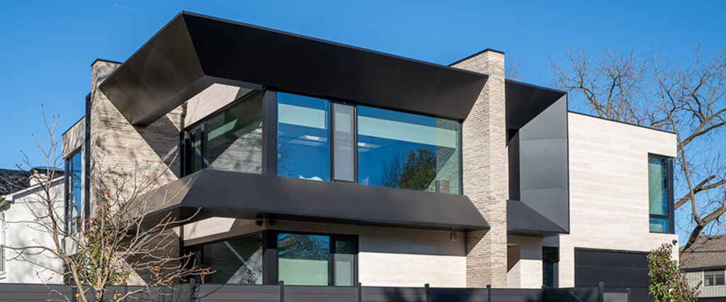 Modern residential facade in North York with Alfrex USA Midnight Black ACM panels and large glass windows.